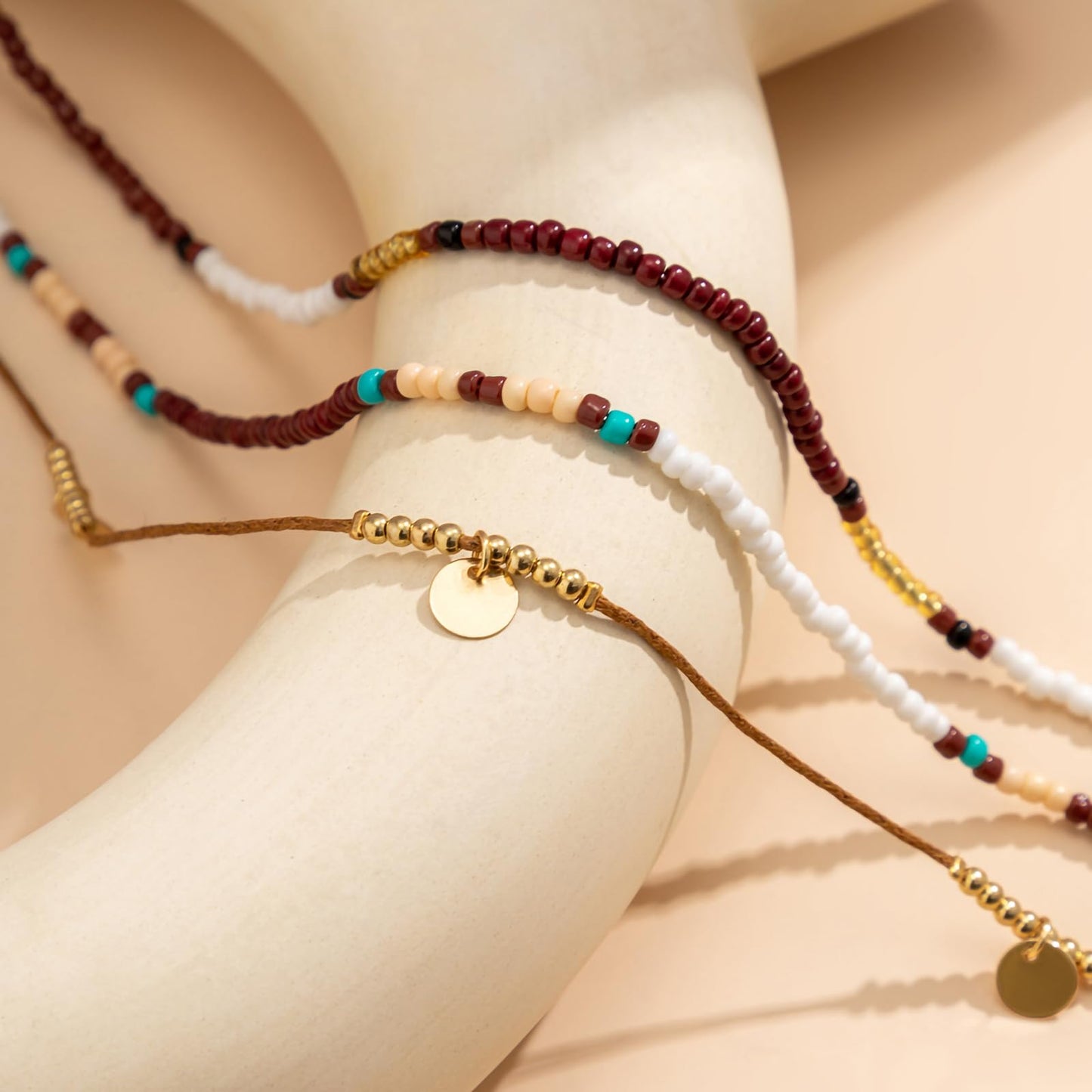Qceasiy Starfish Ankle Bracelets for Women, Boho Beaded Beach Anklets Set | Gold-plated layered anklets in seashell, disc, and conch styles, with stretch or adjustable fits for summer beach outfits. - color: Brown 1