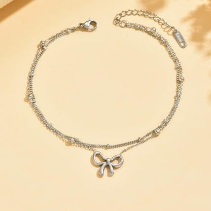 NONAMOIS 18K Gold Plated Diamond Ankle Bracelets for Women Waterproof Gold CZ Pearl Bow Link Chain Anklets Non Tarnish Summer Beach Foot Jewelry Gifts - color: Layered Satellite Bow-White Gold