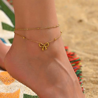 NONAMOIS 18K Gold Plated Diamond Ankle Bracelets for Women Waterproof Gold CZ Pearl Bow Link Chain Anklets Non Tarnish Summer Beach Foot Jewelry Gifts - color: Layered Satellite Bow-Gold