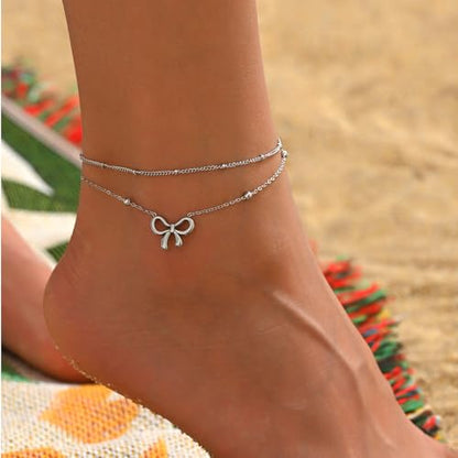 NONAMOIS 18K Gold Plated Diamond Ankle Bracelets for Women Waterproof Gold CZ Pearl Bow Link Chain Anklets Non Tarnish Summer Beach Foot Jewelry Gifts - color: Layered Satellite Bow-White Gold