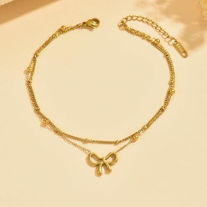 NONAMOIS 18K Gold Plated Diamond Ankle Bracelets for Women Waterproof Gold CZ Pearl Bow Link Chain Anklets Non Tarnish Summer Beach Foot Jewelry Gifts - color: Layered Satellite Bow-Gold