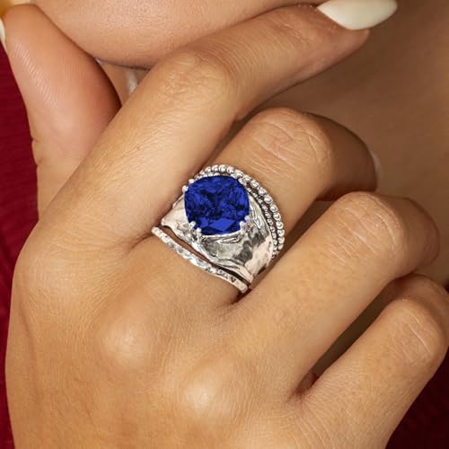 JEAN RACHEL JEWELRY 925 Sterling Silver Prong Solitaire Ring | Raised crown engagement style ring mounting a precision faceted brilliant Cubic Zirconia solitaire over stacked silver rows. - color: Sapphire CZ