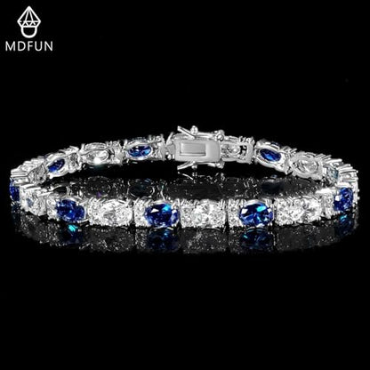 MDFUN 18K White/Yellow Gold Plated Green/Blue 5 * 7MM Oval 5A+ Cubic Zirconia Tennis Bracelet for Women Birthstone Jewelry Gift 6.5-8.5 inch - color: 18K White Gold -Blue