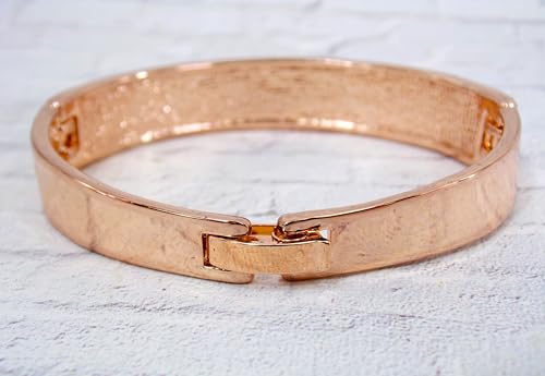Pink crystal bangle bracelet with sparkling crystals expandable open hinge in a rose gold finish. Women's fashion dressy formal wedding bracelet