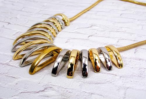 Silver and gold necklace designed with dome shape metal links attached to a snake chain. Two tone fashion necklace.