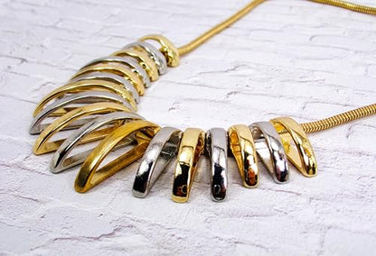 Silver and gold necklace designed with dome shape metal links attached to a snake chain. Two tone fashion necklace.