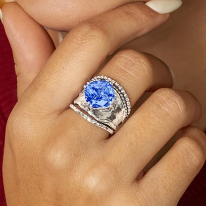 JEAN RACHEL JEWELRY 925 Sterling Silver Prong Solitaire Ring | Raised crown engagement style ring mounting a precision faceted brilliant Cubic Zirconia solitaire over stacked silver rows. - color: Tanzanite CZ