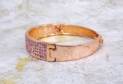 Pink crystal bangle bracelet with sparkling crystals expandable open hinge in a rose gold finish. Women's fashion dressy formal wedding bracelet