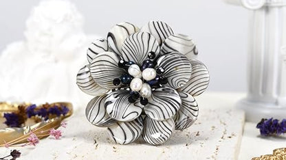 AeraVida Wild & Stylish Black & White Pearls with Painted Stripes on Mother of Pearl Seashell Floral Brooch Pin for Retro Zebra or Animal Print Inspired Fashion Accessories