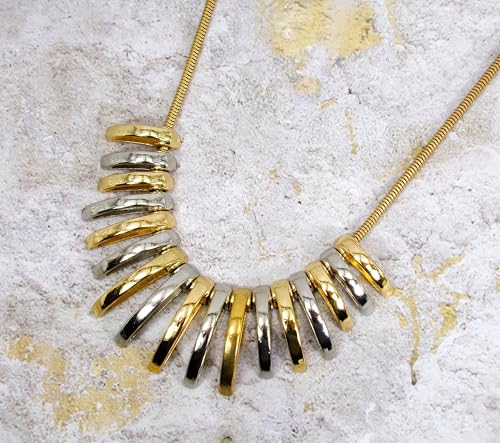 Silver and gold necklace designed with dome shape metal links attached to a snake chain. Two tone fashion necklace.