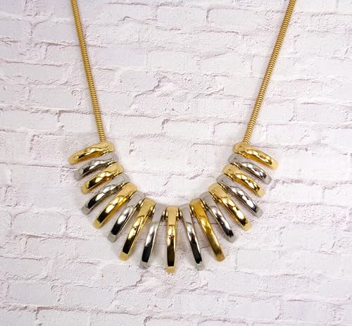 Silver and gold necklace designed with dome shape metal links attached to a snake chain. Two tone fashion necklace.