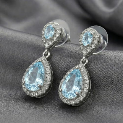 Mariell Cubic Zirconia Crystal Teardrop Dangle Bridal and Wedding Earrings, CZ Jewelry for Brides, Bridesmaids, Homecoming, Prom and Dressy Everyday Wear - color: Silver-Blue Cubic Zirconia