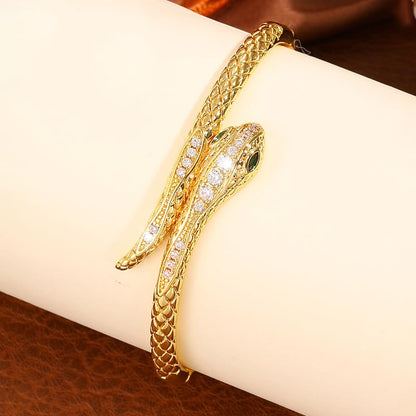 Gold Snake Bangle Bracelet for Women, Cubic Zirconia Copper Cuff Jewelry | Gold-plated copper snake cuff with cubic zirconia, green stone accent and comfortable open cuff design.