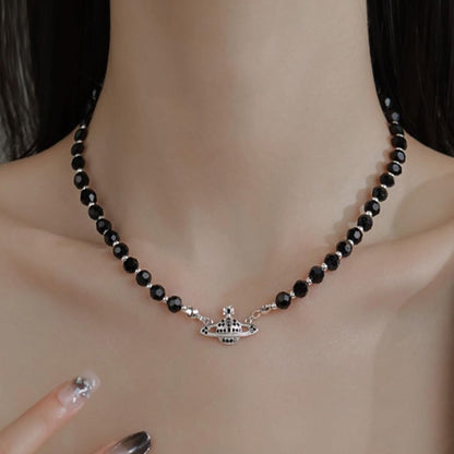 Dreuyet Saturn Pearl Necklace and Earrings Set Crystal Planet Earrings Dainty Artificial Pearl Choker Necklace Charm Gifts for Mum Wife Wedding Birthday Anniversary - color: Black with Bracelet