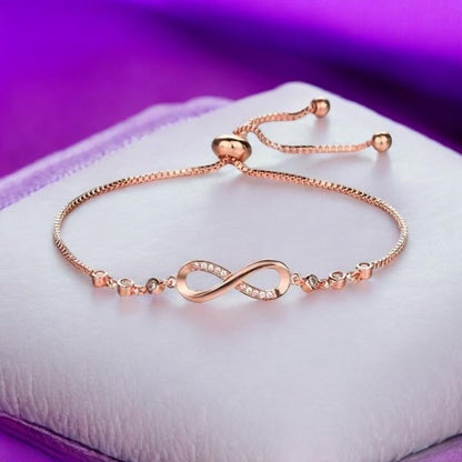 Nilu's Collection Infinity Shape Cubic Zirconia Diamond Bracelet for Women, Jewelry for Gift, Adjustable Charm Bracelet (Rose Gold Necklace + Bracelet) - color: Rose Gold