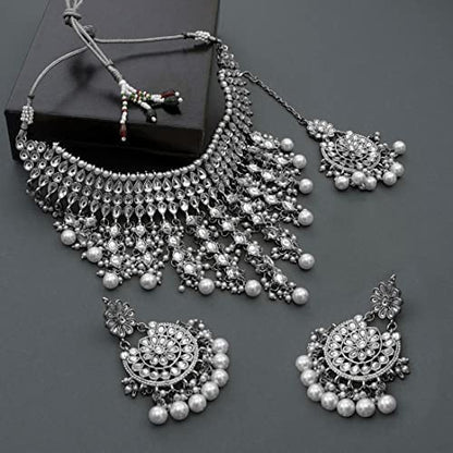 Aheli Elegant Indian Wedding Wear Faux Kundan Studded Choker Necklace with Maang Tikka Set Ethnic Fashion Jewelry for Women Maroon Kundan & Pearl Drop - color: Rhodium White