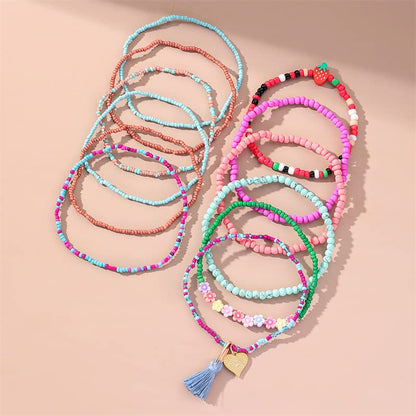 12 Pieces Colorful Elastic Beaded Anklets for Women Girls Handmade Beach Boho Colorful Beads Tassel Heart Flower Layered Anklets Set