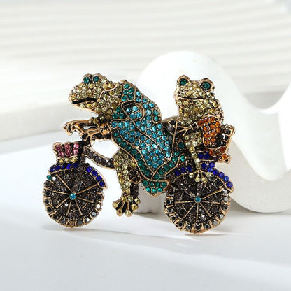 2Pcs Two Frogs Riding Bike Brooch Vintage-Inspired Sparkling Rhinestone Animal Brooch Pin Fashion Accessory